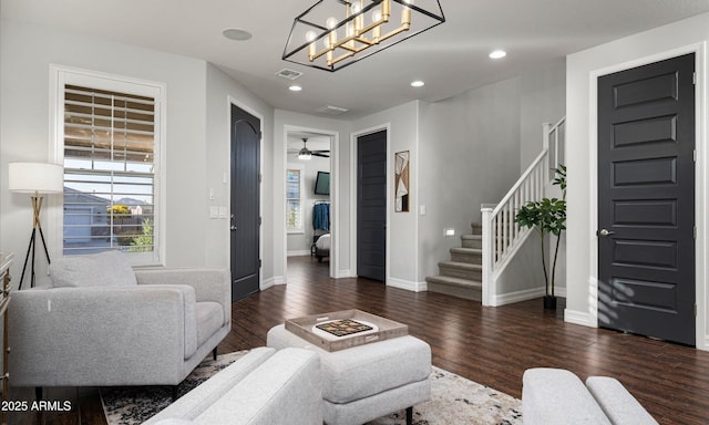 2915 W Night Owl Ln, Phoenix, AZ 85085 - living room with dark wood-style flooring, stairway, baseboards, recessed lighting, and a chandelier