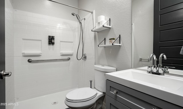 2915 W Night Owl Ln, Phoenix, AZ 85085 - full bathroom with a textured wall, toilet, vanity, and tiled shower