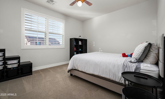 2915 W Night Owl Ln, Phoenix, AZ 85085 - carpeted bedroom with baseboards and ceiling fan