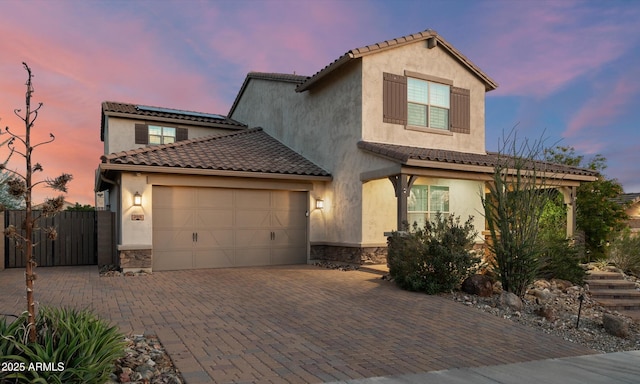 2915 W Night Owl Ln, Phoenix, AZ 85085 - view of front of home featuring stucco siding, a garage, solar panels, decorative driveway, and a tile roof