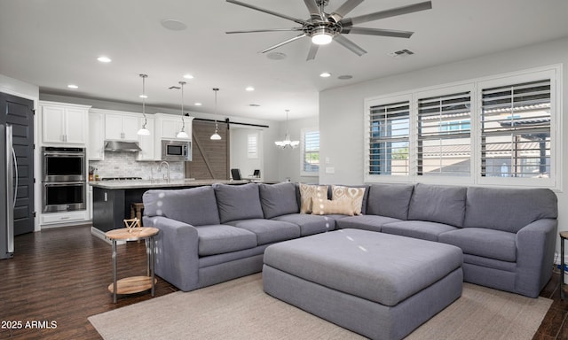 2915 W Night Owl Ln, Phoenix, AZ 85085 - living area featuring recessed lighting, a ceiling fan, dark wood finished floors, and a chandelier