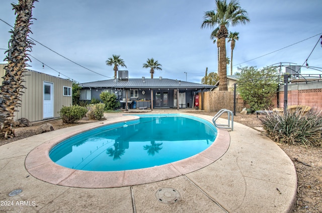 view of swimming pool featuring a patio area