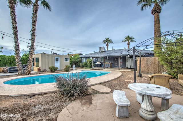 view of swimming pool featuring a patio