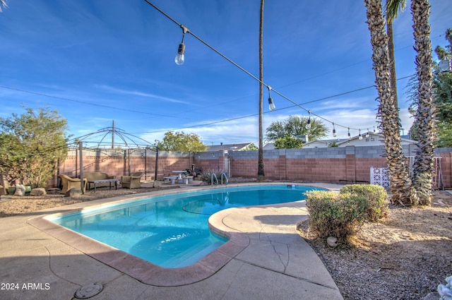 view of pool with a gazebo and a patio