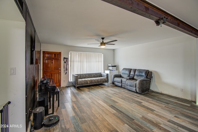 living room with beam ceiling, ceiling fan, and hardwood / wood-style flooring