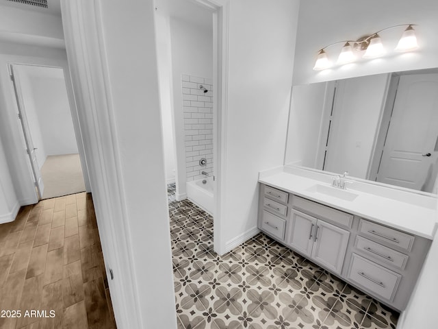 full bath featuring shower / bathtub combination, visible vents, and vanity