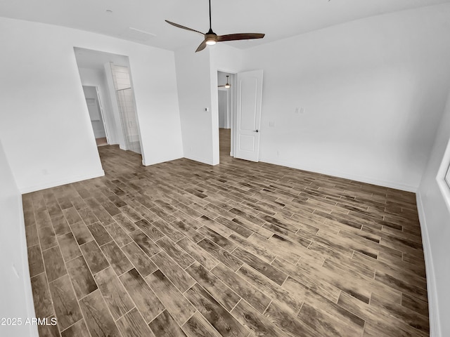interior space with a ceiling fan and wood finished floors