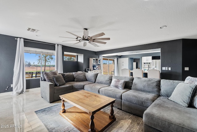 living room featuring ceiling fan