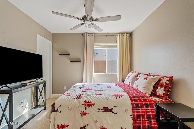 bedroom with ceiling fan and carpet