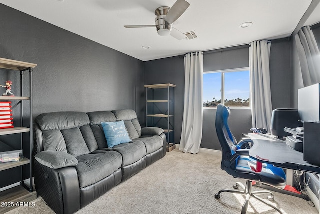 carpeted office with ceiling fan