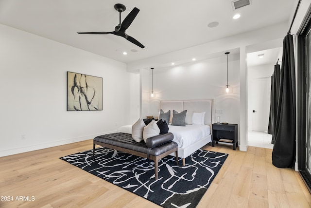 bedroom featuring ceiling fan and wood-type flooring