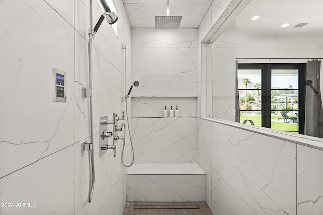 bathroom featuring tiled shower