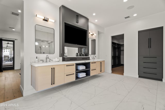 bathroom with a shower and vanity