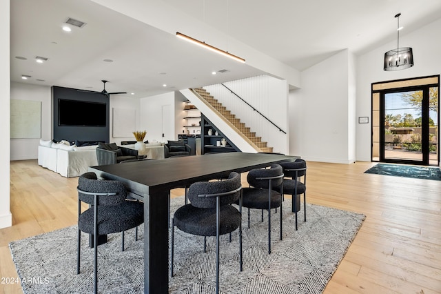 dining room with light wood-type flooring and ceiling fan