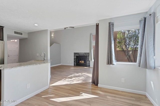 1380 Vista Montana Rd Unit 22, Sedona, AZ 86336 - unfurnished living room featuring baseboards, light wood finished floors, and recessed lighting