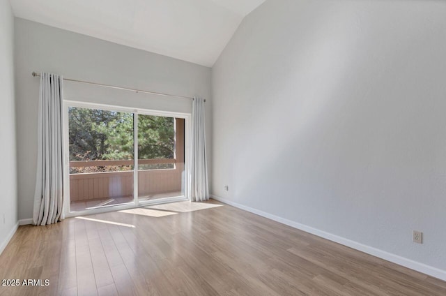 1380 Vista Montana Rd Unit 22, Sedona, AZ 86336 - spare room with wood finished floors, vaulted ceiling, and baseboards