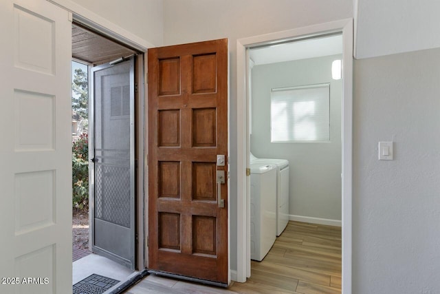 1380 Vista Montana Rd Unit 22, Sedona, AZ 86336 - foyer featuring independent washer and dryer, light wood-style flooring, and baseboards