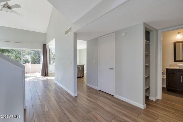 1380 Vista Montana Rd Unit 22, Sedona, AZ 86336 - hallway featuring wood finished floors, baseboards, and high vaulted ceiling
