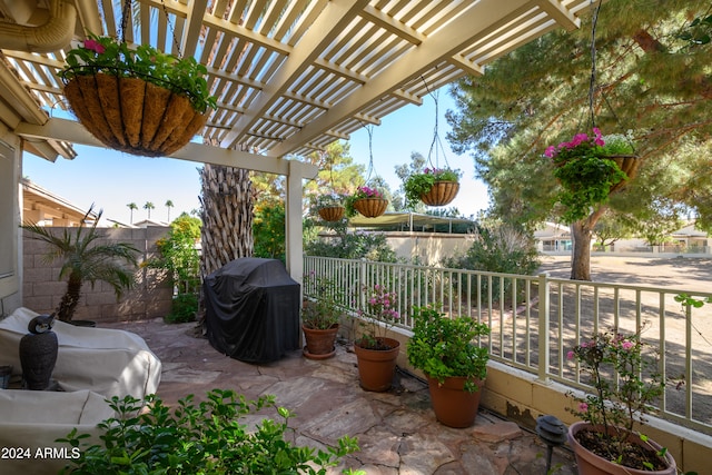 view of patio with a pergola and grilling area