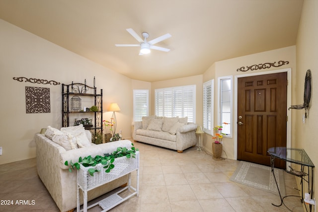 tiled living room with ceiling fan