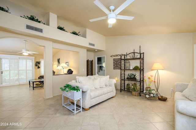 living room with light tile patterned floors and ceiling fan