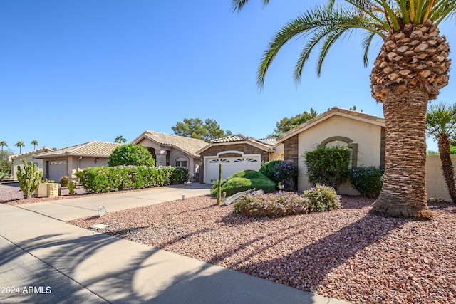 mediterranean / spanish-style home featuring a garage