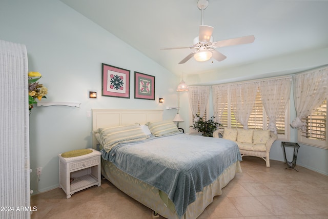 tiled bedroom featuring vaulted ceiling and ceiling fan