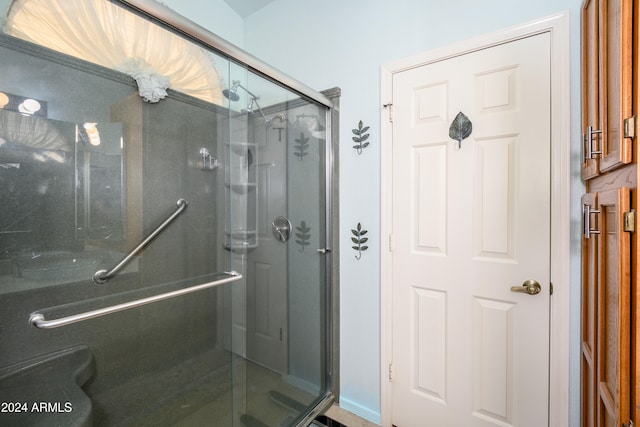 bathroom with toilet and walk in shower