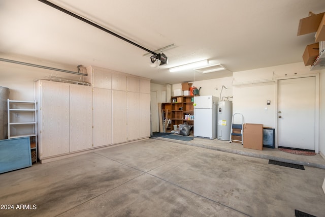 garage with a garage door opener, water heater, and white refrigerator