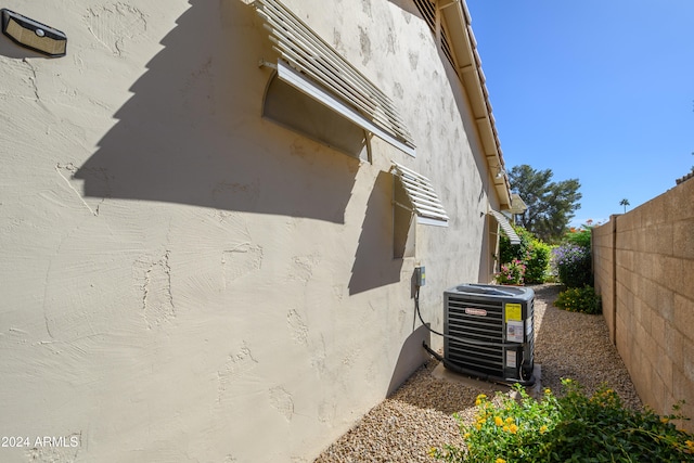 view of property exterior with central AC