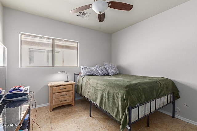 tiled bedroom featuring ceiling fan