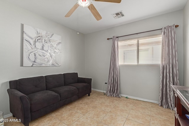 living room with light tile patterned floors and ceiling fan