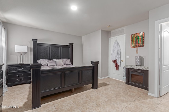 bedroom with light tile patterned floors