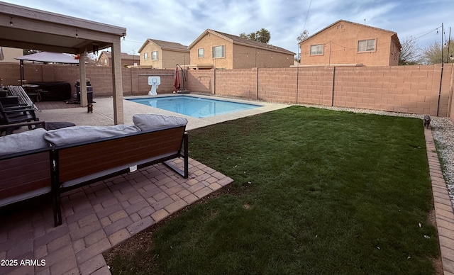 view of pool with a patio, a yard, an outdoor hangout area, and area for grilling