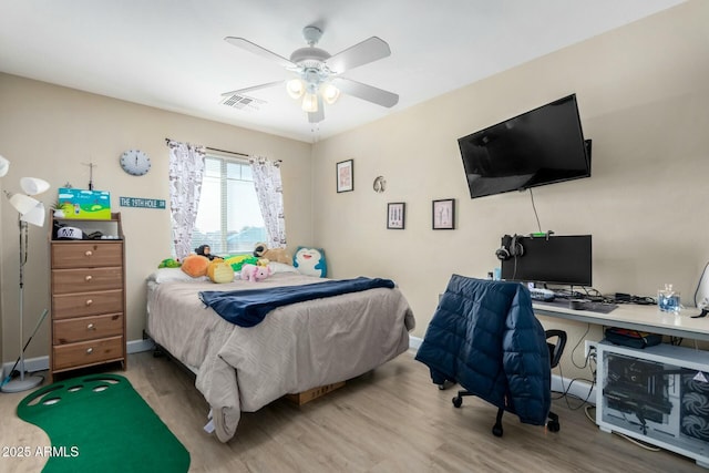 bedroom with hardwood / wood-style flooring and ceiling fan