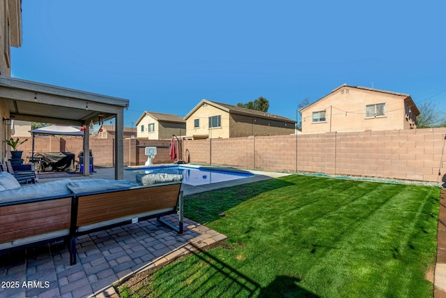 view of yard with a fenced in pool, a patio, and an outdoor living space