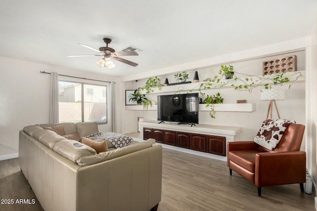 living room featuring hardwood / wood-style flooring and ceiling fan