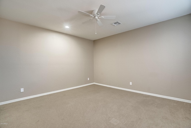 unfurnished room with carpet flooring and ceiling fan