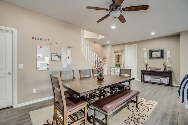 dining room with ceiling fan and wood-type flooring