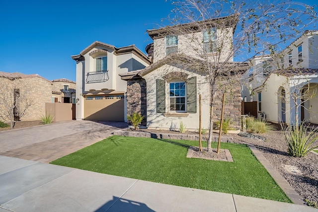 view of front of house featuring a balcony, a front lawn, and a garage