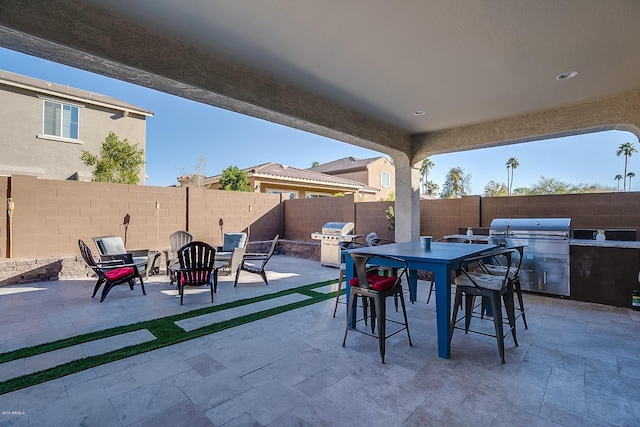 view of patio / terrace with area for grilling and a grill