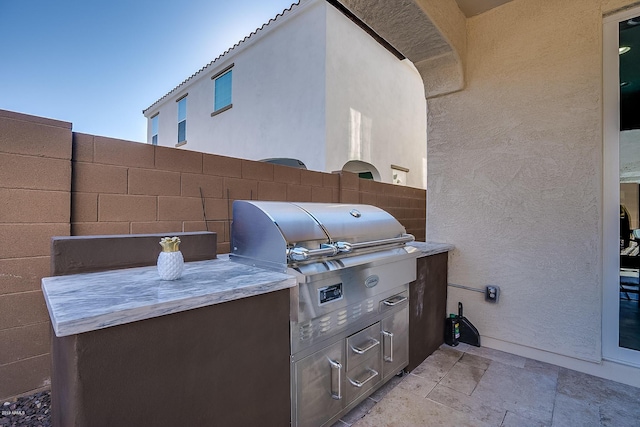 view of patio / terrace featuring area for grilling and exterior kitchen