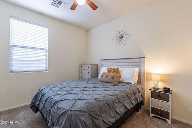 bedroom featuring dark colored carpet and ceiling fan