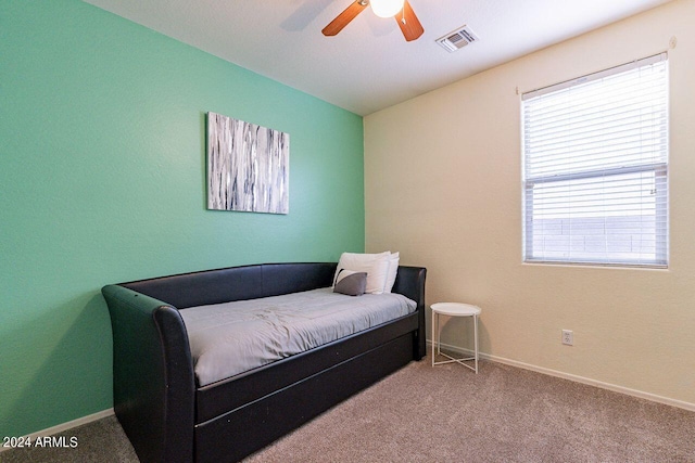 carpeted bedroom featuring ceiling fan