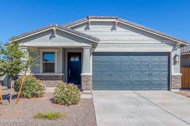 view of front of property with a garage