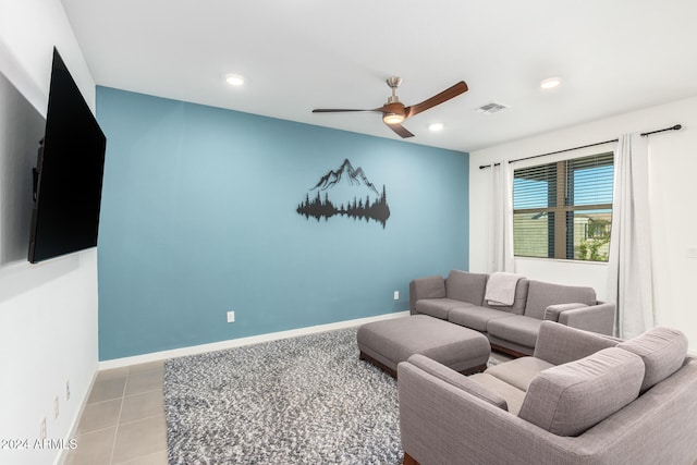 living room featuring light tile patterned floors and ceiling fan