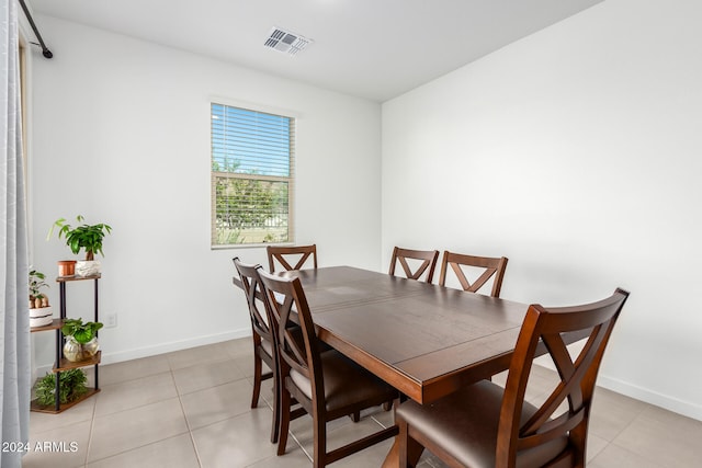 dining area with light tile patterned floors