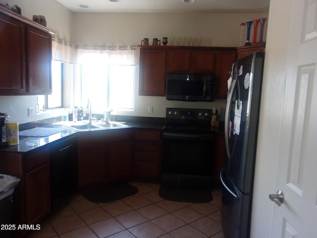 4616 E Monument Way, Rimrock, AZ 86335 - kitchen with black appliances, dark countertops, and light tile patterned flooring