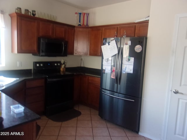 4616 E Monument Way, Rimrock, AZ 86335 - kitchen featuring black appliances, dark countertops, brown cabinets, and light tile patterned flooring