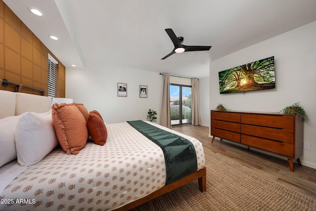 bedroom featuring a ceiling fan, wood finished floors, baseboards, and recessed lighting